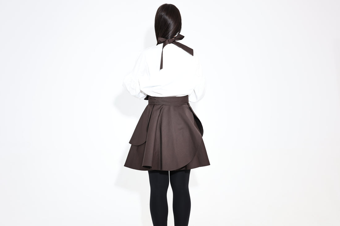 Back view of the dark brown Daisy apron with a ribbon tie at the neck