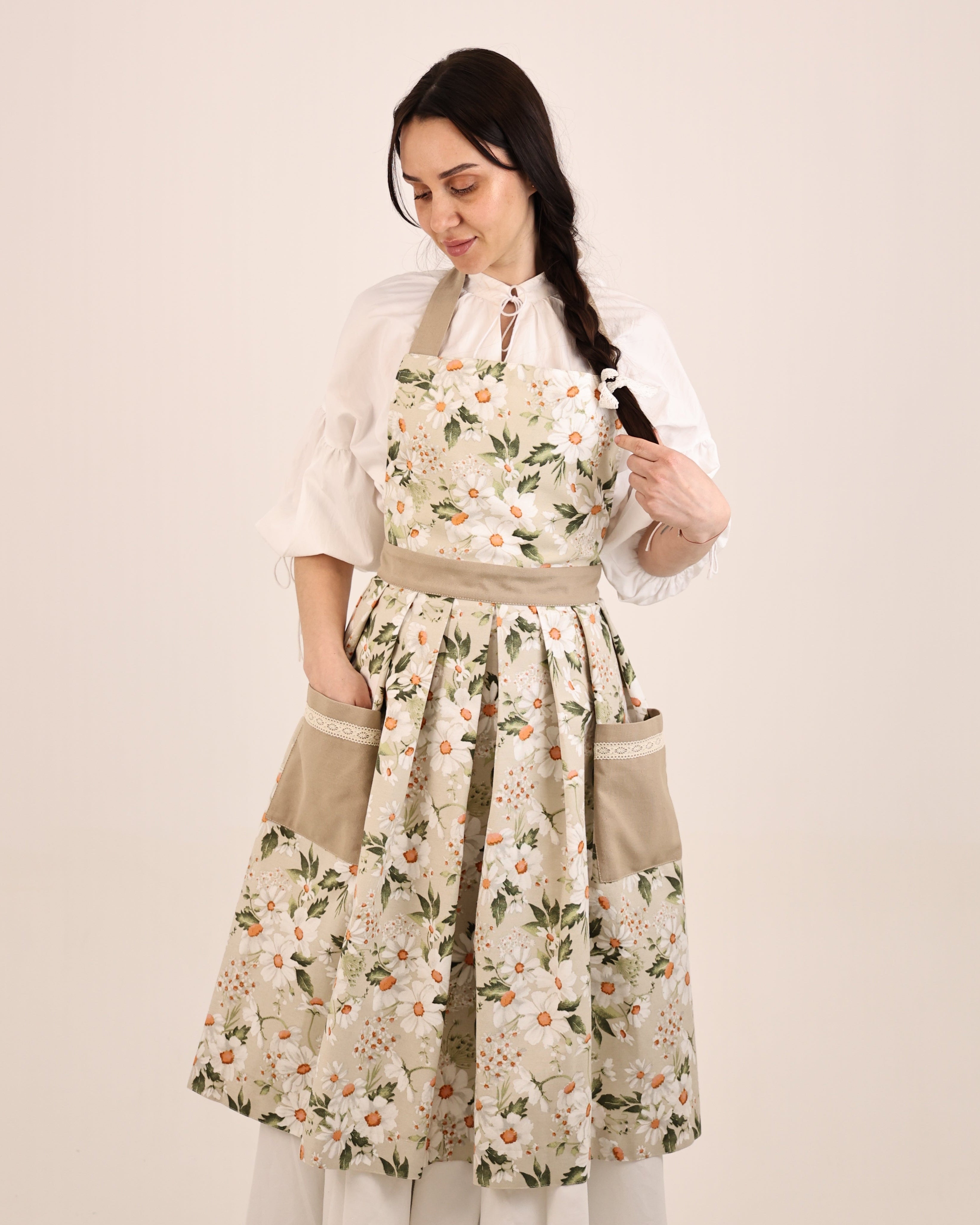Woman wearing a floral dress with a plain background
