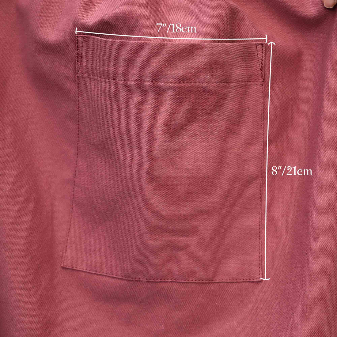 Maroon fabric pocket with measurements on a matching background