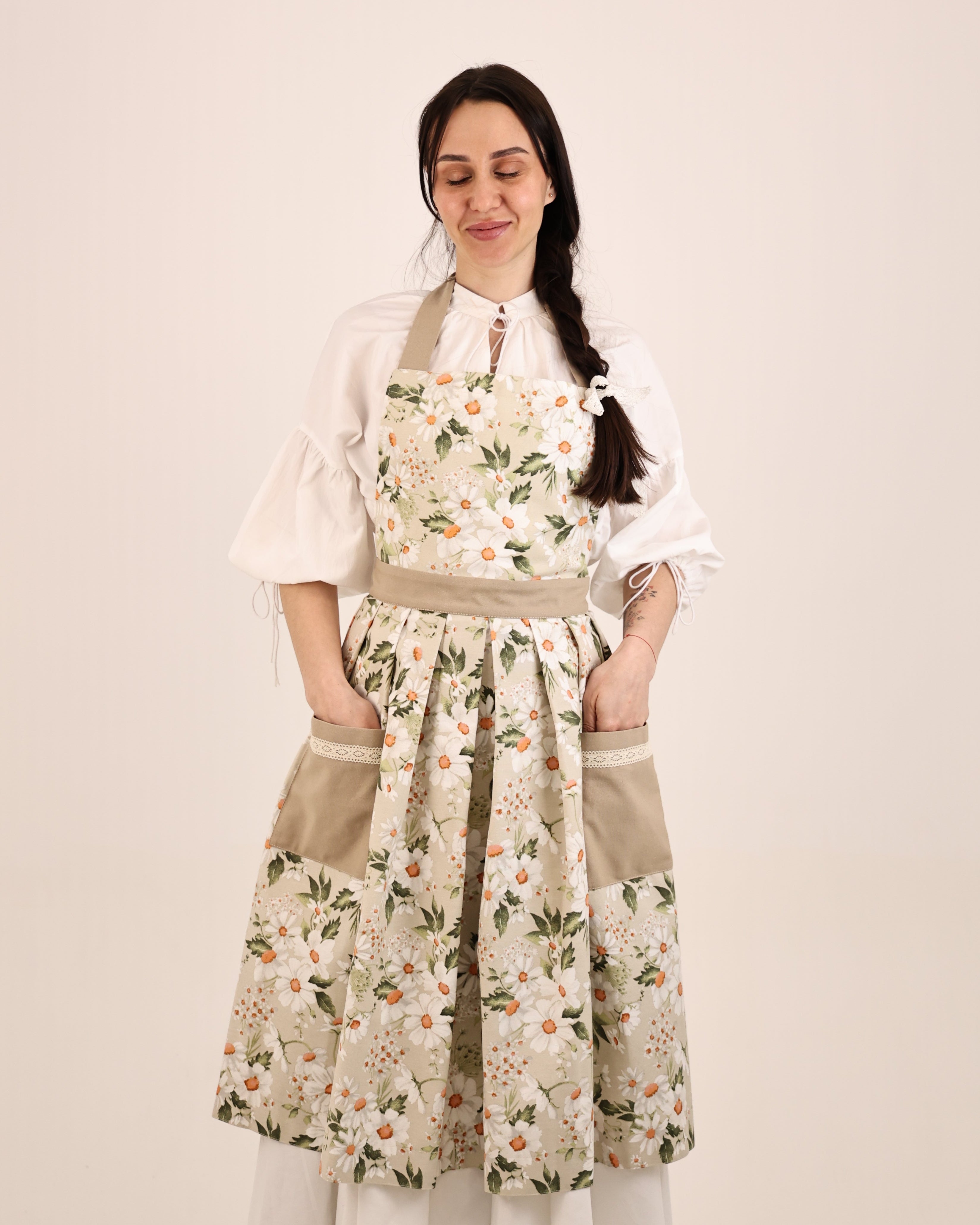 Woman wearing a floral dress on a plain background